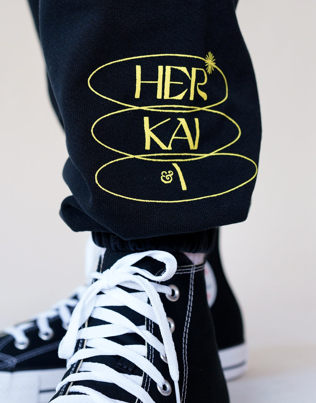 Detail Shot of Her Kai & Logo Puff Print at bottom of sweatpants. Boundless in Divinity Sweatpants