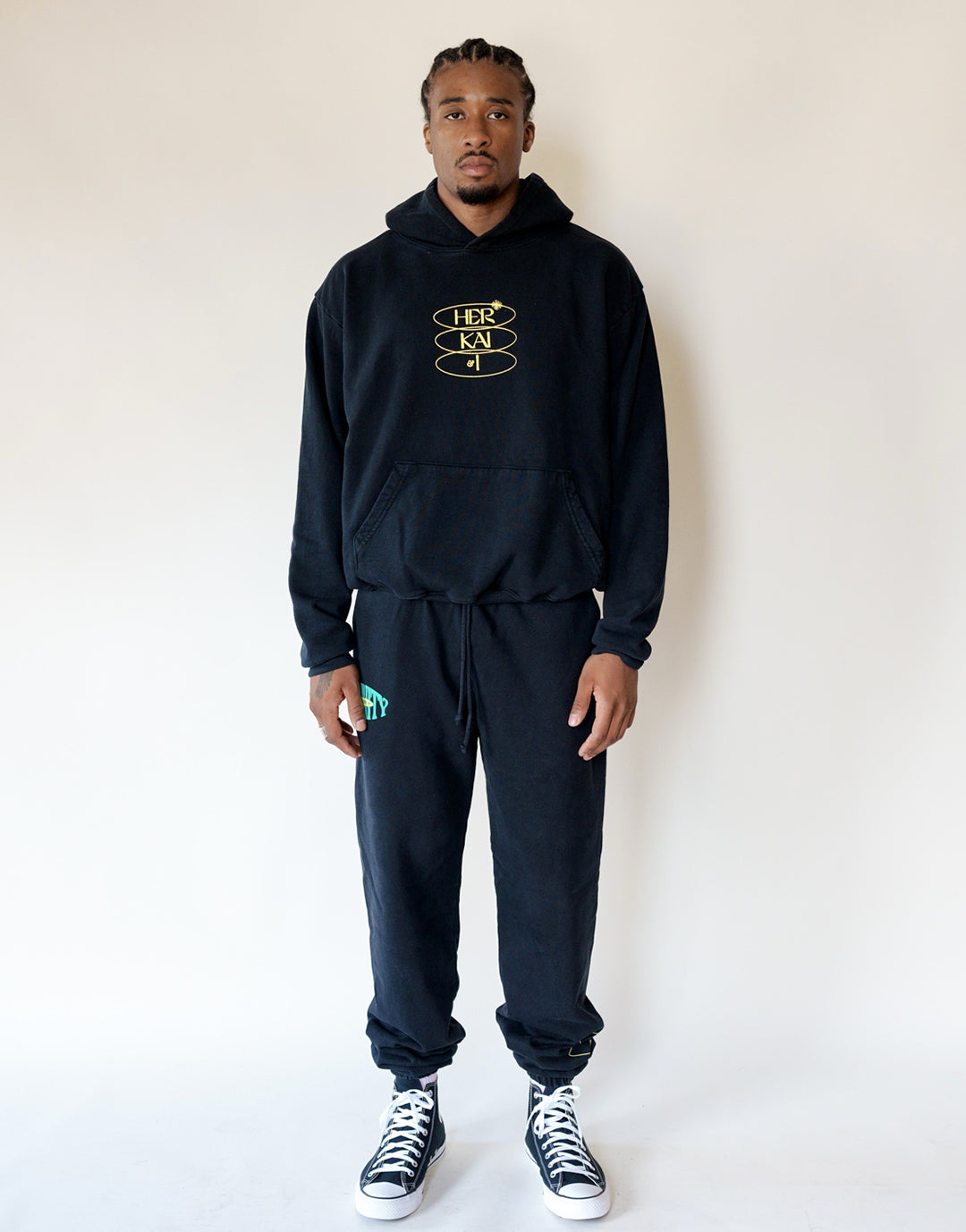 Model is wearing a size Large. Our Boundless in Divinity Hoodie in Black features our signature Her Kai & I Logo Puff Print. 100% French Cotton Terry Hooded Sweatshirt