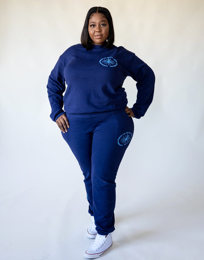 Model wears Universal Pursuit Crewneck in size XL. 100% French Cotton Terry Crewneck Sweatshirt in Waves Deep