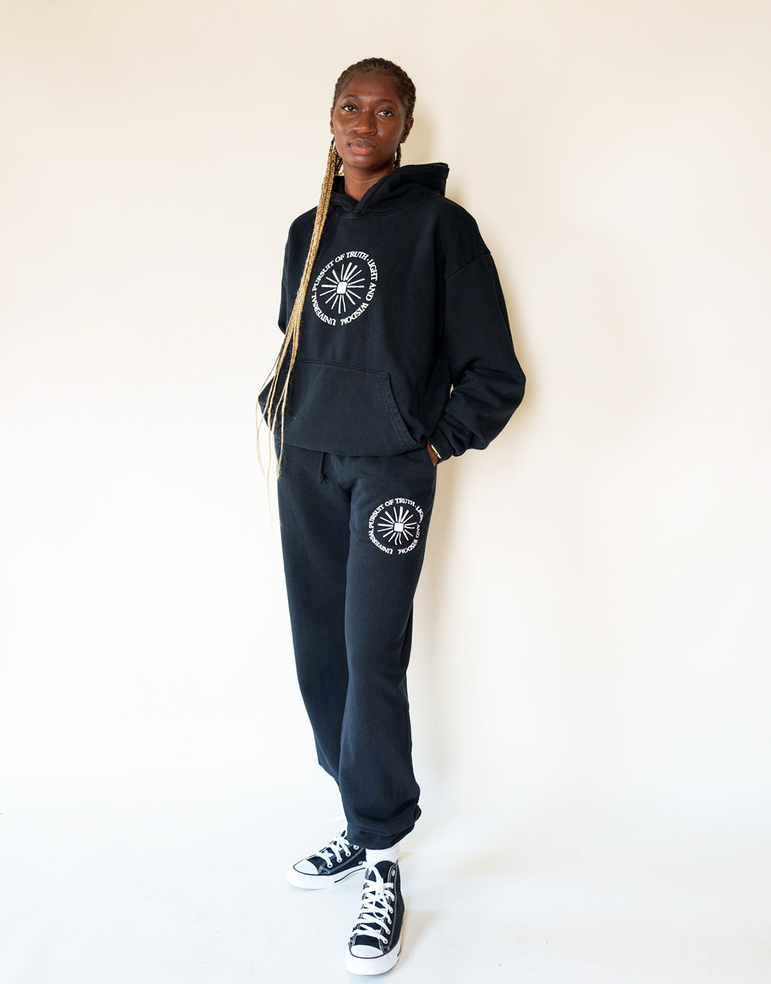 Model wears Universal Pursuit Hoodie in size Small. 100% Cotton French Terry Hooded Sweatshirt in Black Beauty