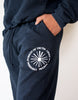 Detail Shot of Universal Pursuit Graphic Puff Print on model.